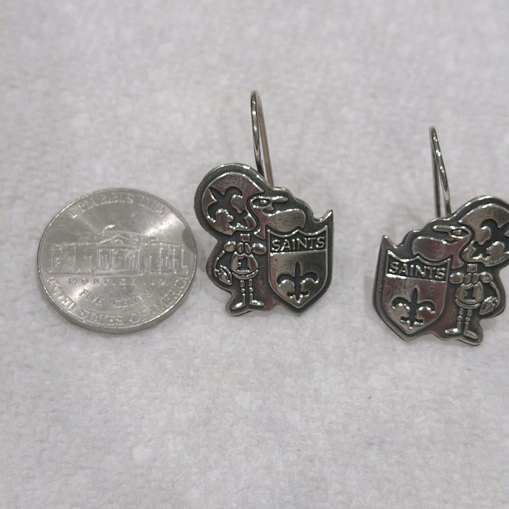 Solid sterling silver 925 stamped. Original “sir Saint “ earrings.